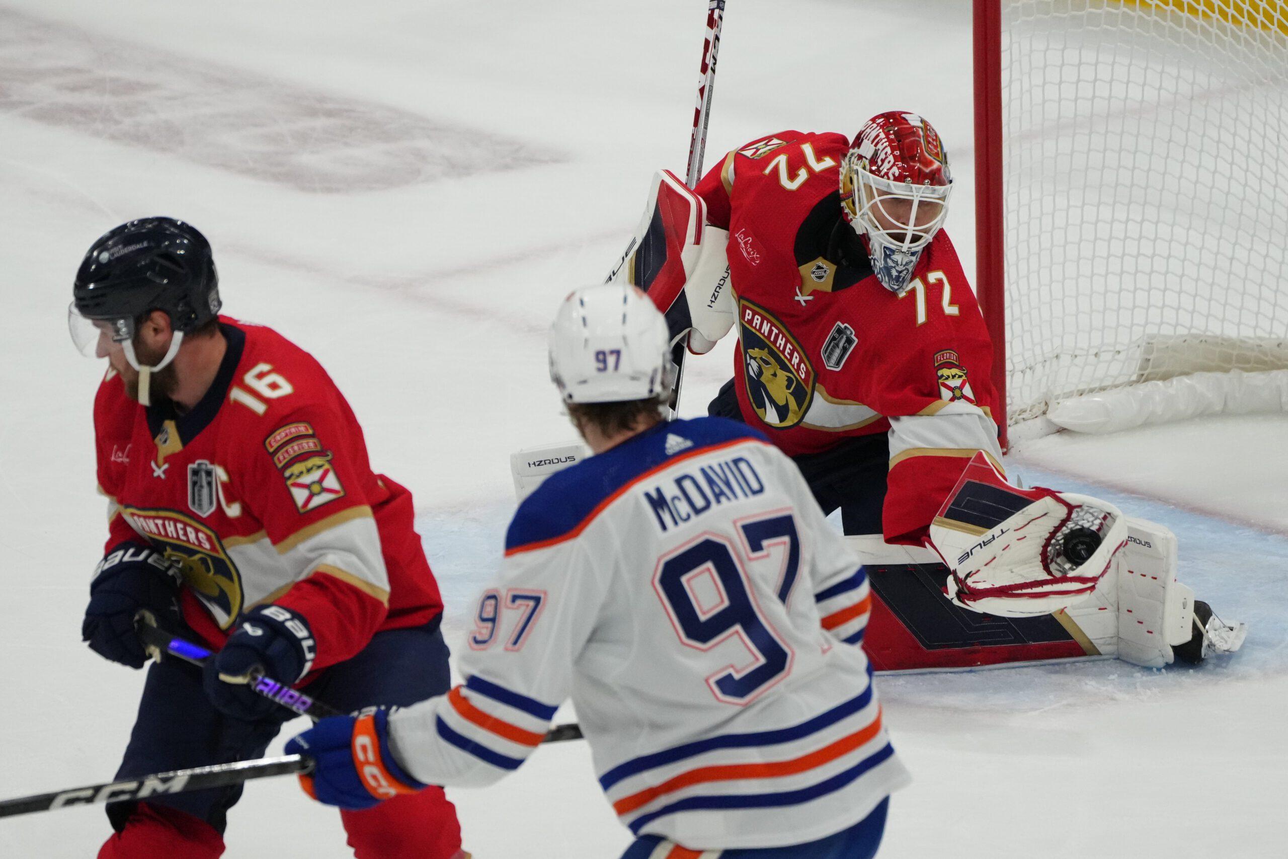 Aleksander Barkov, Connor McDavid and Sergei Bobrovsky