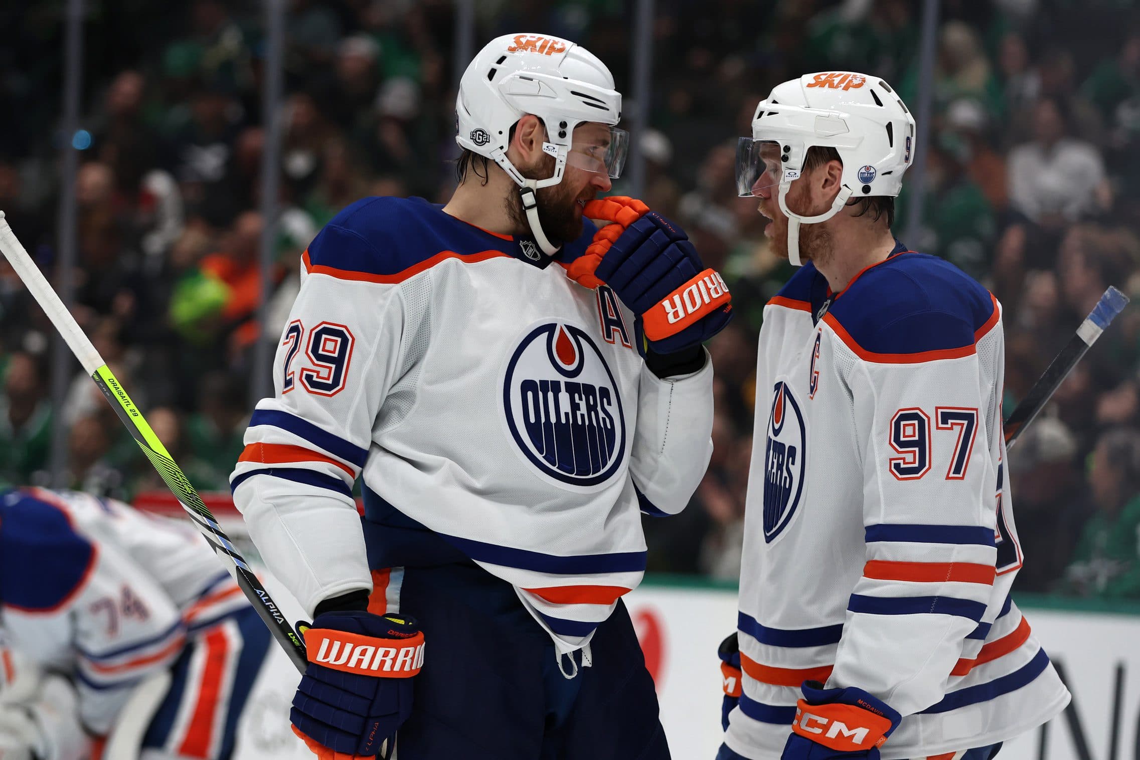 Edmonton Oilers center Leon Draisaitl (29) talks to center Connor McDavid (97) in the second period against the Dallas Stars at American Airlines Center.