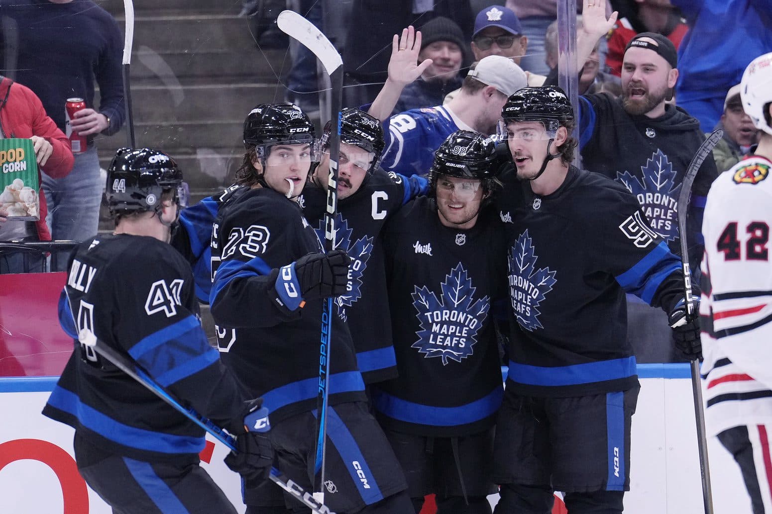 Toronto Maple Leafs forward Matthew Knies (23), defenseman Morgan Rielly (44), forward William Nylander (88), and defenseman Philippe Myers (51) celebrate a goal by forward Auston Matthews (34) against the Chicago Blackhawks during the first period at Scotiabank Arena.