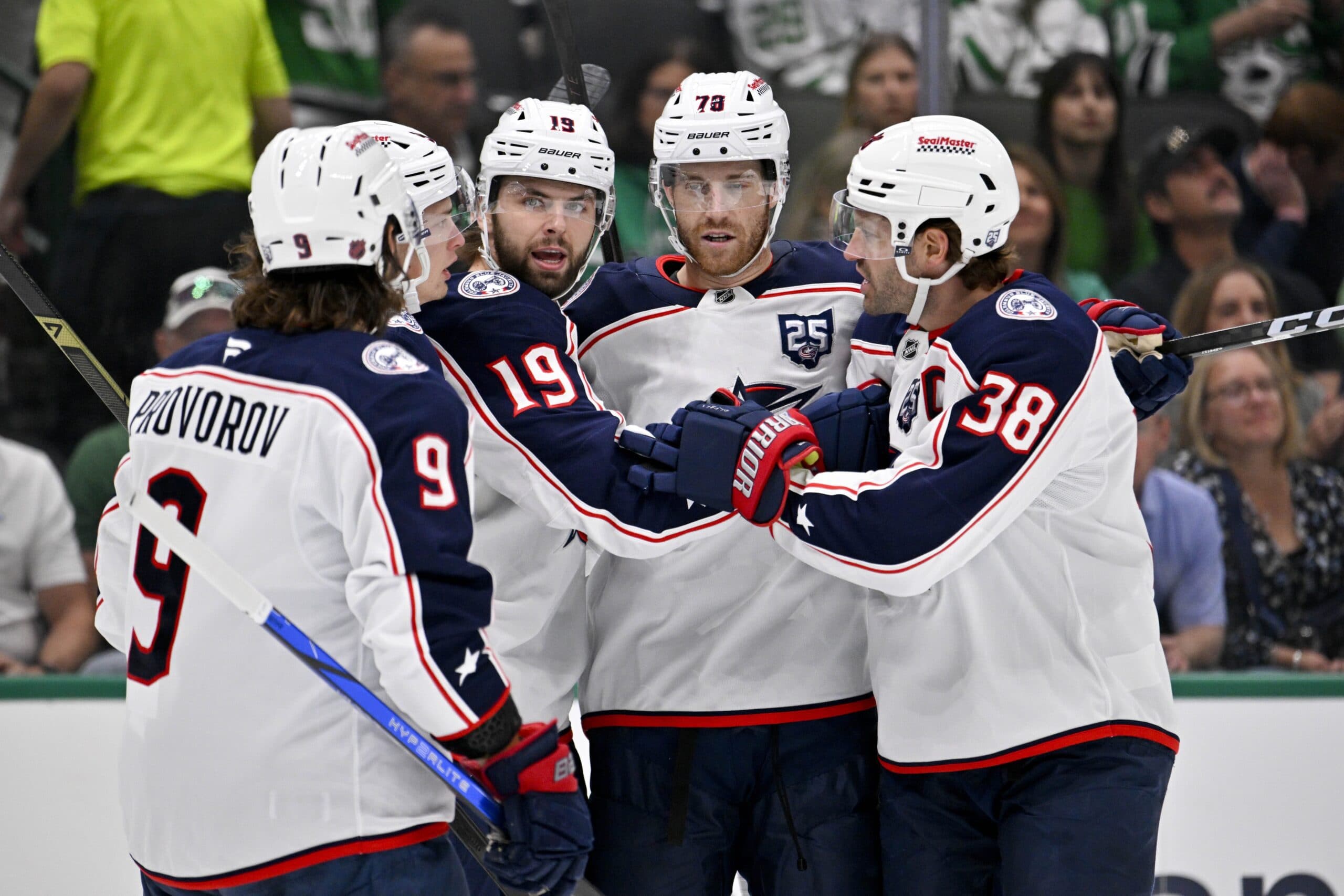 Columbus Blue Jackets defenseman Ivan Provorov (9) and center Adam Fantilli (19) and defenseman Damon Severson (78) and center Boone Jenner (38) celebrates a goal scored by Fantilli against the Dallas Stars during the first period at the American Airlines Center.